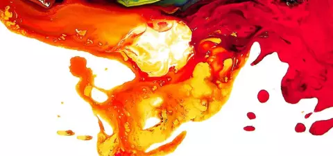 Abstract image featuring vibrant swirls of colors including red, orange, yellow, and turquoise, creating a dynamic and fluid composition.