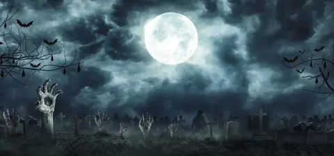 A spooky graveyard scene under a full moon, featuring eerie hands emerging from the ground, bats flying overhead, and tombstones silhouetted against a cloudy sky.
