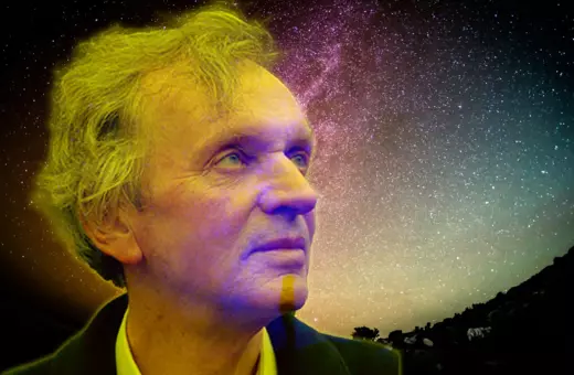 A contemplative man with tousled hair gazes upward against a starry night sky, suggesting introspection and a connection to the cosmos.