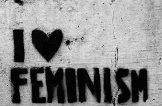 Graffiti on a concrete wall reads 