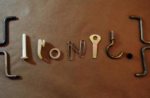 The image displays various objects arranged to spell 