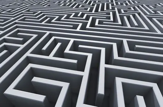 A complex three-dimensional maze with intricate pathways and high walls, rendered in a sleek gray material, showcasing a labyrinthine structure.
