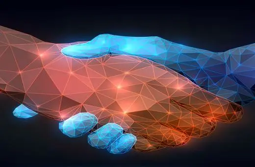 A polygonal handshake illustration symbolizing cooperation and partnership, with one hand in warm colors and the other in cool colors against a dark background.