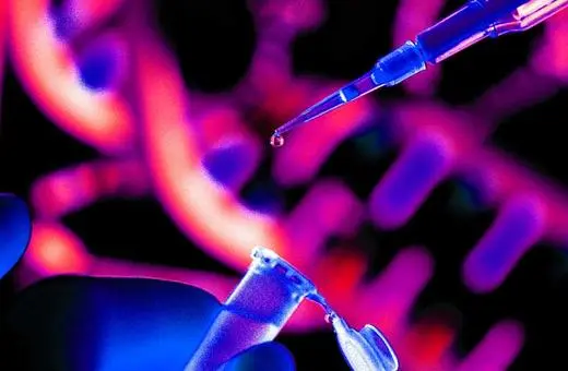 A close-up of a laboratory scene featuring a pipette dispensing a droplet into a test tube, with colorful, abstract DNA strands in the background.