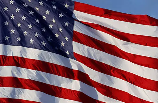 A close-up view of the American flag, displaying its red and white stripes along with the blue field of stars.