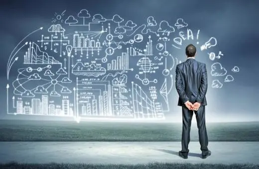A businessman in a suit stands facing a wall of creative data and graph illustrations, contemplating future ideas and possibilities.